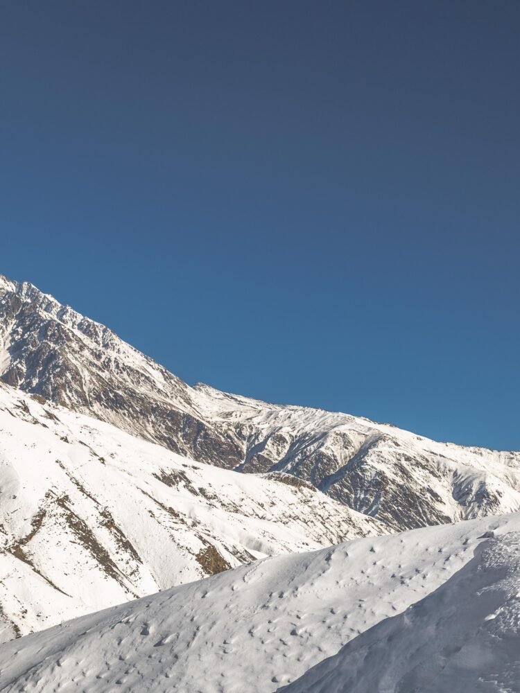 man on mountain with snow