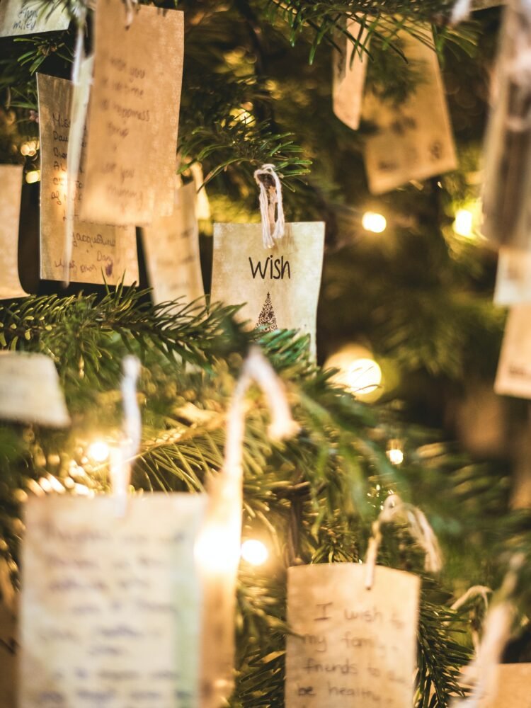 cards hanging on Christmas tree